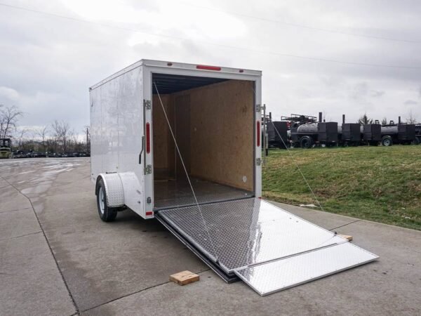 6' x 12' white enclosed v nose trailer with diamond plate floor storage