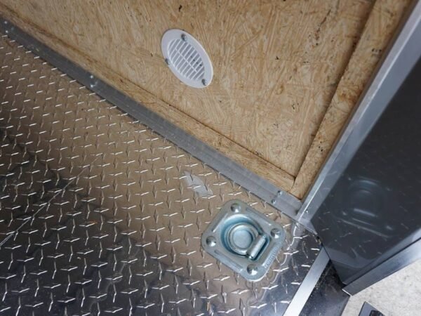 6' x 12' white enclosed v nose trailer with diamond plate floor storage