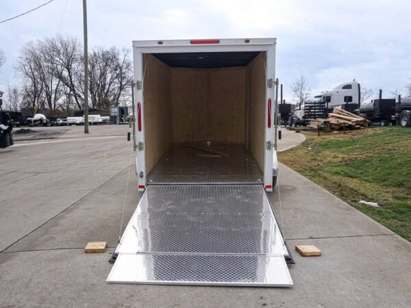 6' x 12' white enclosed v nose trailer with diamond plate floor storage