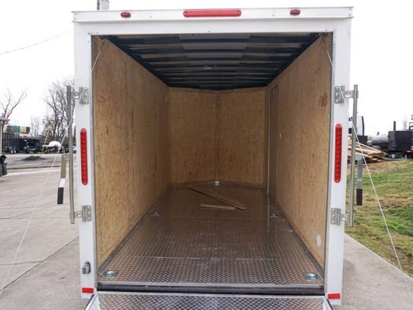6' x 12' white enclosed v nose trailer with diamond plate floor storage