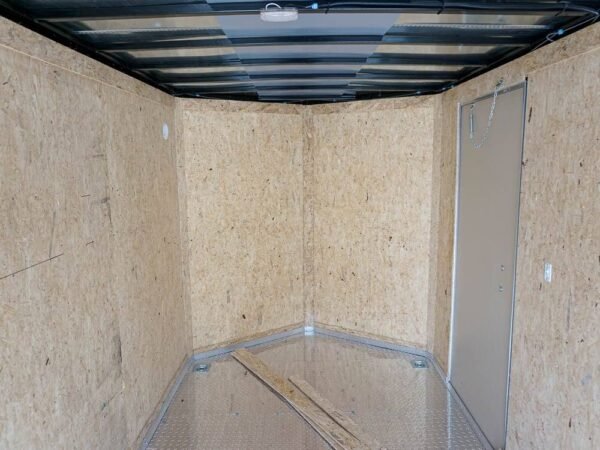 6' x 12' white enclosed v nose trailer with diamond plate floor storage