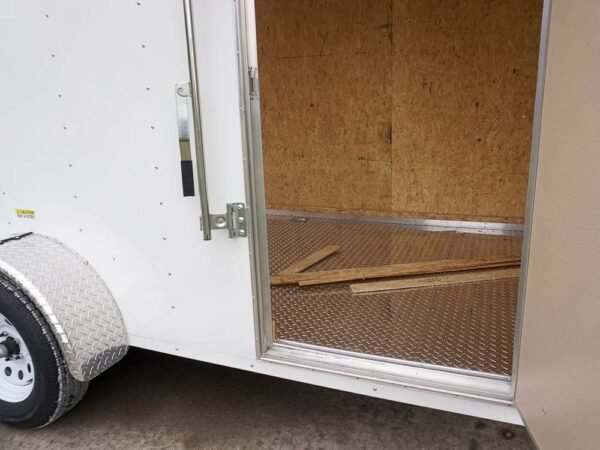 6' x 12' white enclosed v nose trailer with diamond plate floor storage